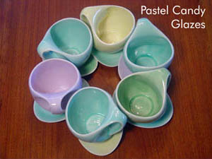Modern design coffee mugs with vibrant pastel transparent glazes.