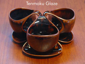 Stacking Tenmoku coffee cups with saucer lids.